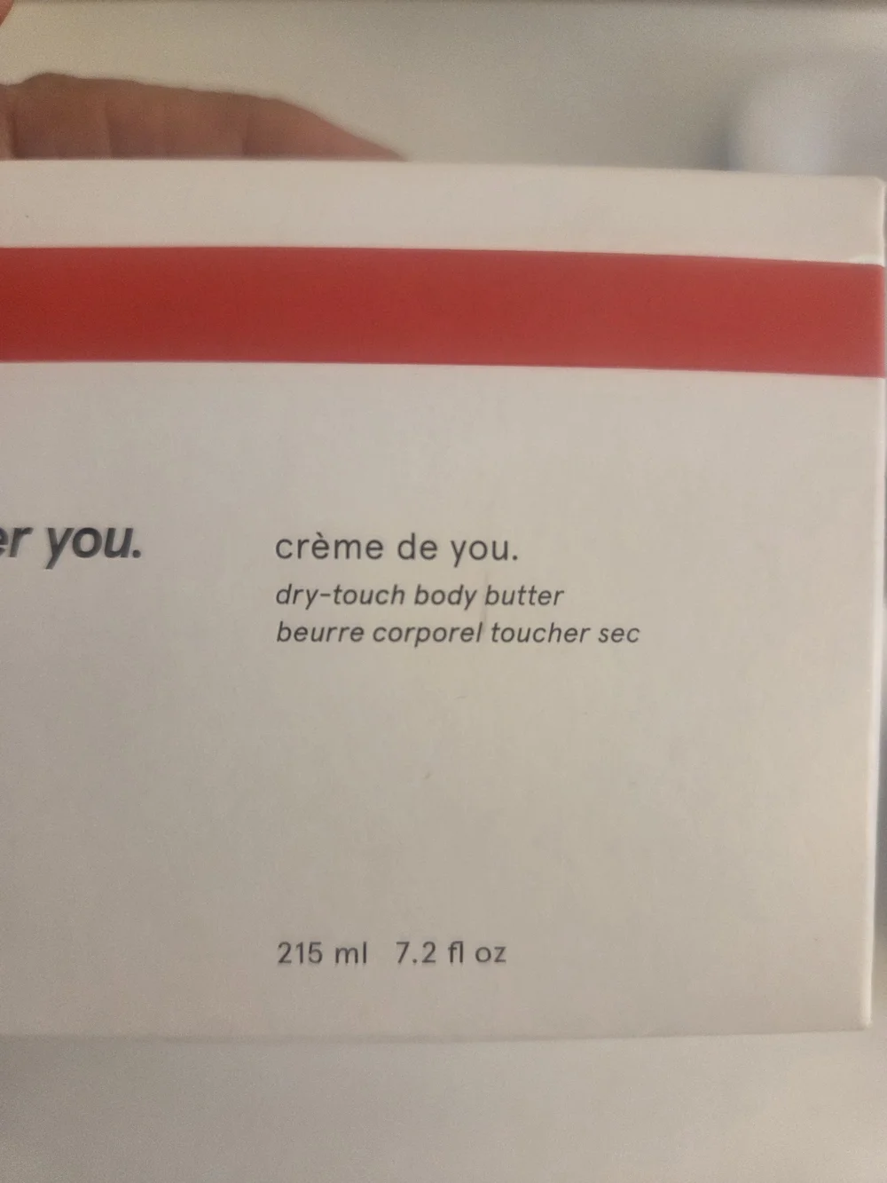 Glossier cream white with red stripe